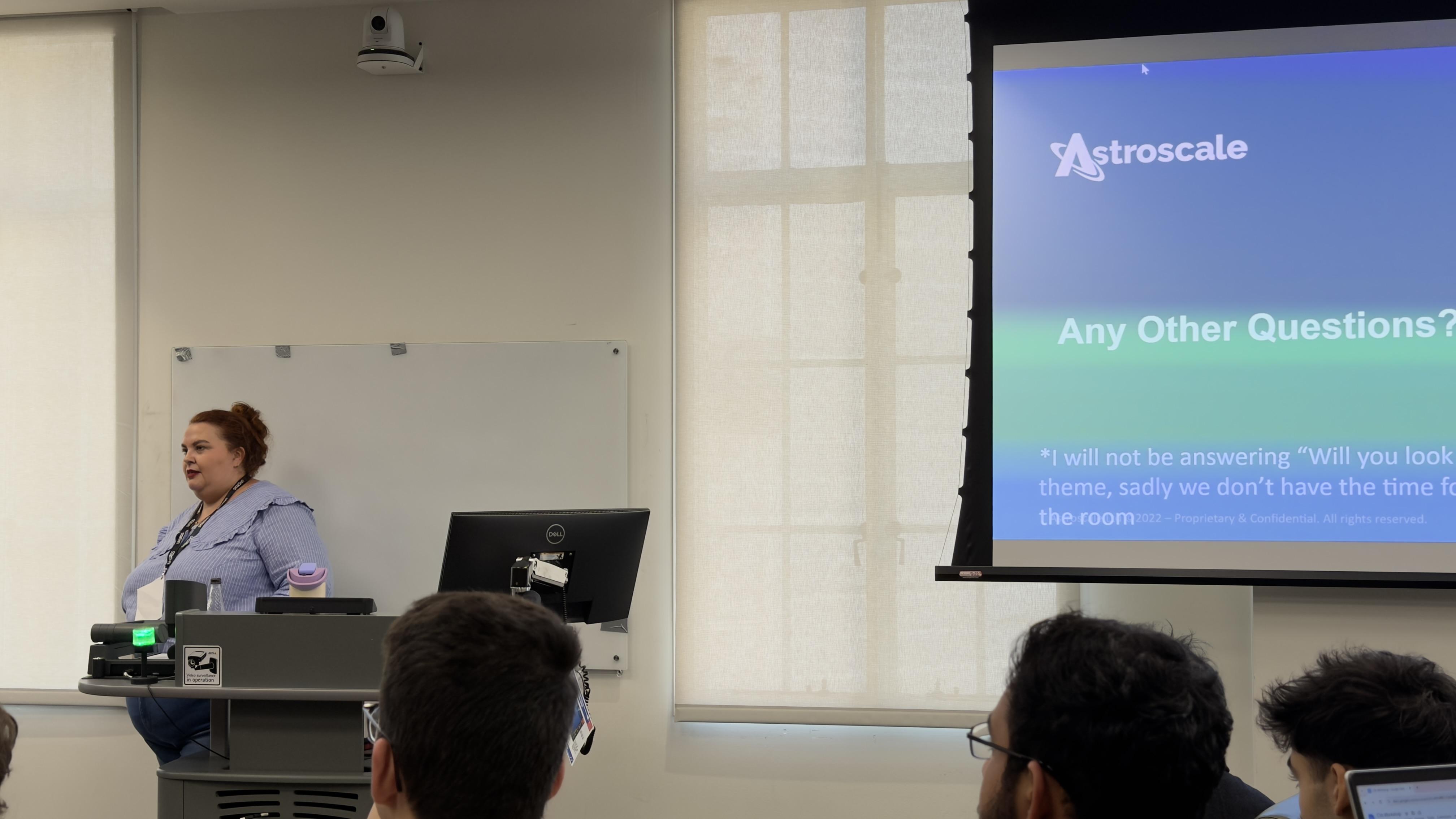 A photo from the CV workshop, showing the host next to a presentation.